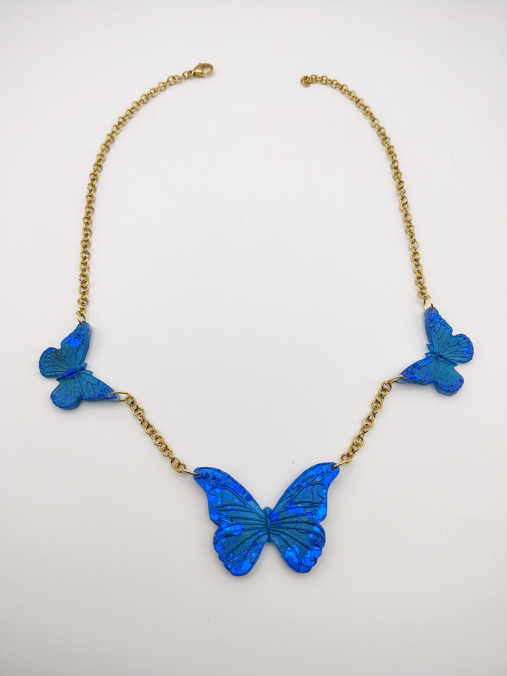 Collier Papillon en résine époxy fait main – Bijou féerique artisanal