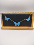 Collier Papillon en résine époxy fait main – Bijou féerique artisanal