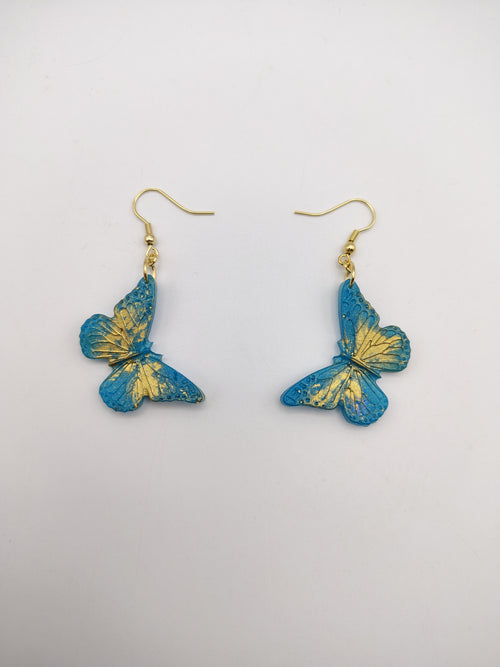 Boucles d’oreilles Papillon en résine époxy faites main – Bijou féerique artisanal